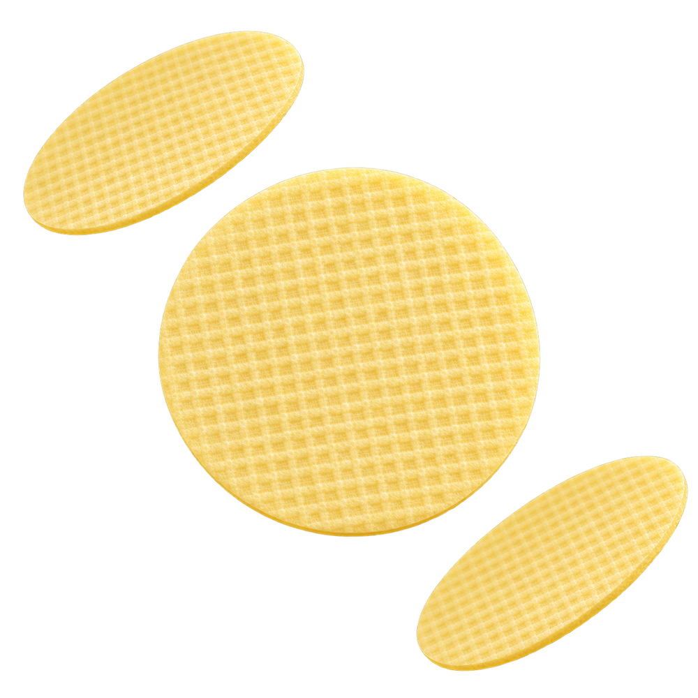 Three thin round Turmeric and Kojic skincare pads floating at different angles